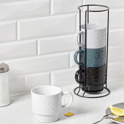 7 of 8:Home Basics Juego de tazas apilables de 4 piezas con soporte, margarita en relieve 